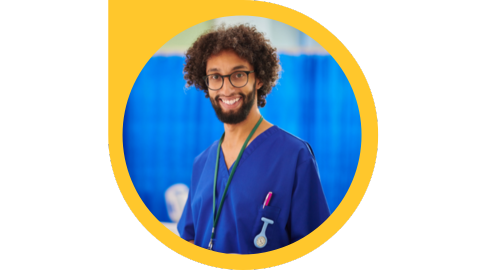 A profile picture of a health-care professional in scrubs who has an afro, full beard, and is wearing glasses.