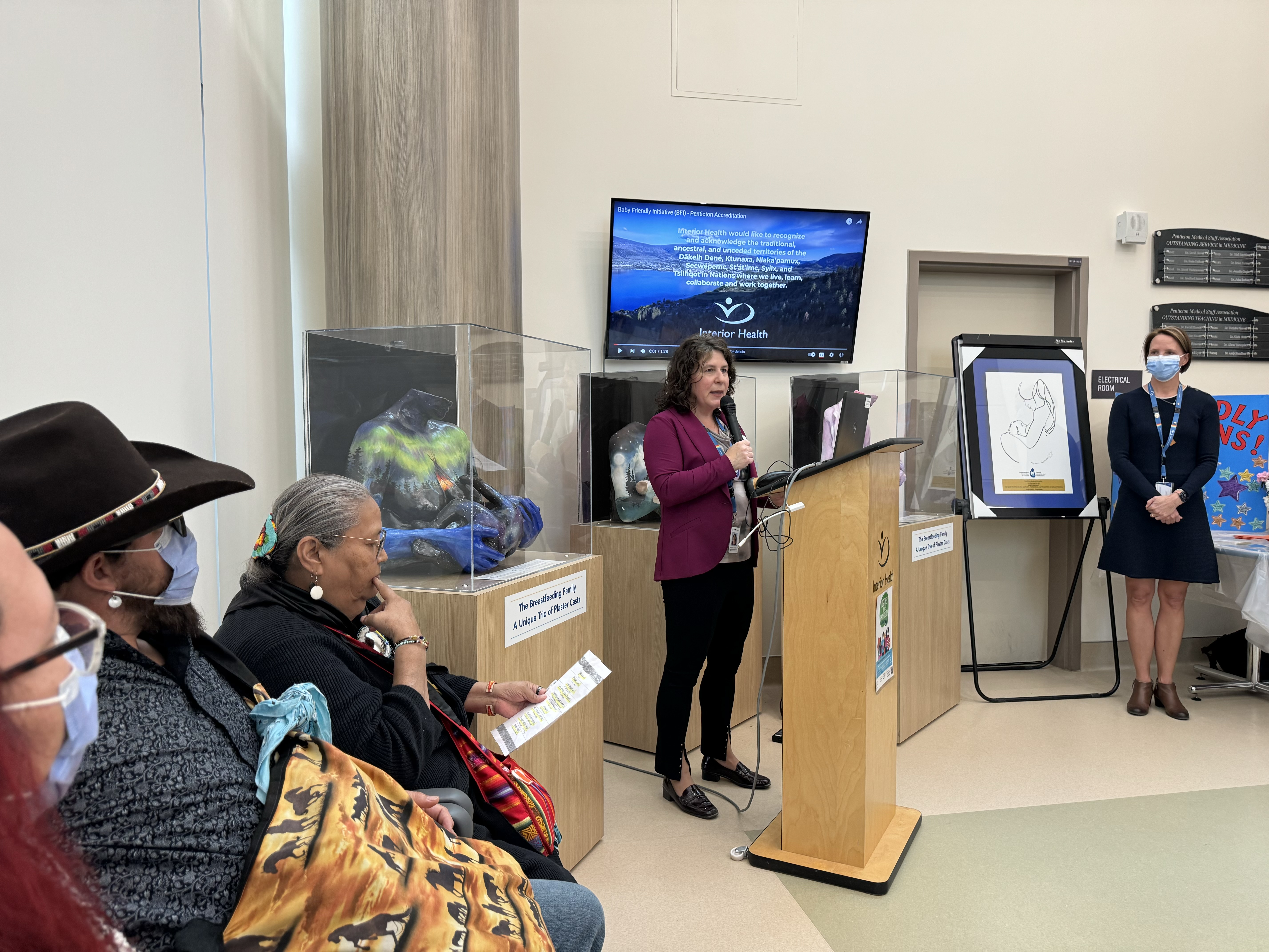 Women speaking at podium