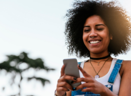 A woman checks out her phone.