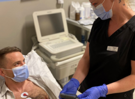 A nurse treats a patient.