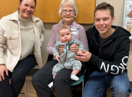 Family with mom, dad, baby and grandmother.