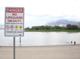 A sign on the beach warning there is no lifeguard on duty.