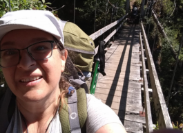 Woman taking photo on a bridge. 